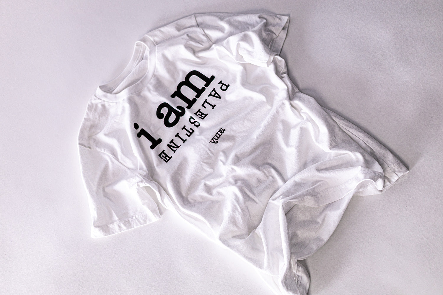 white i am Palestine shirt flat lay YUMA 