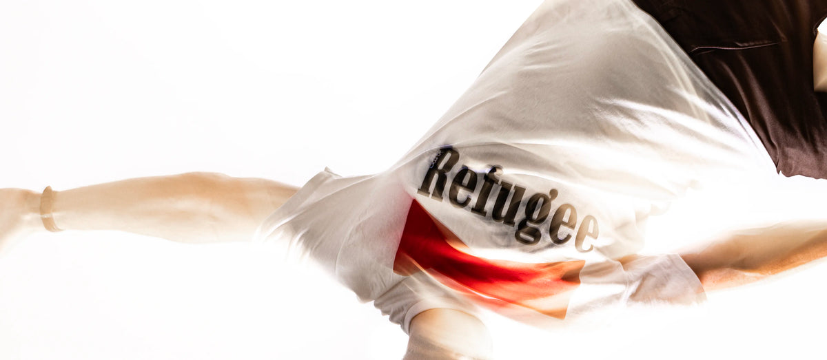 upside down model with the word refugee upside down with a red marlboro chevron on a white shirt