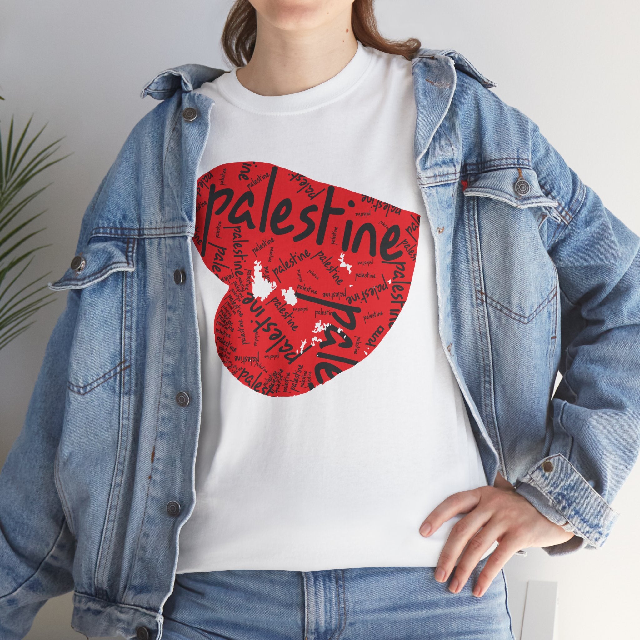 Woman wearing white Palestine Heart tee under jacket — Palestinian clothing — The YUMA Project