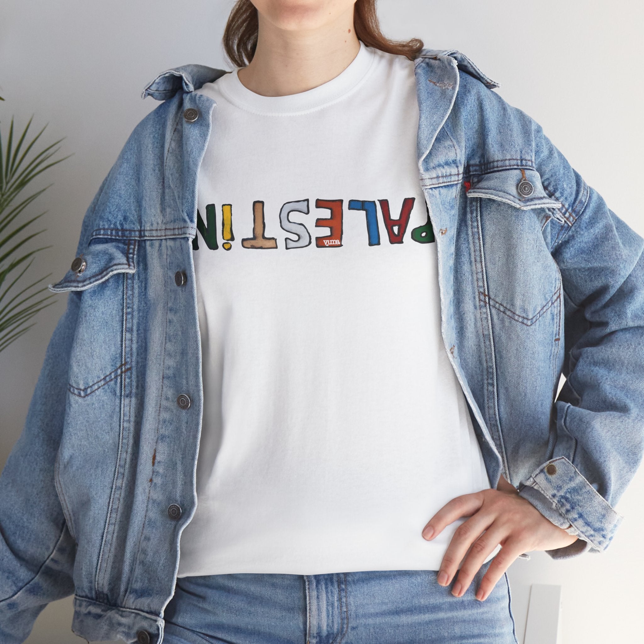 Woman wearing white Palestine Shirt tee under jacket — Palestinian clothing — The YUMA Project